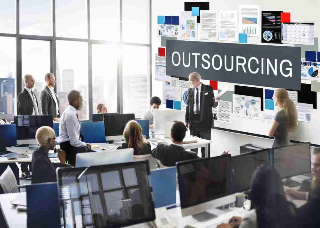 one-man-standing-and-presenting-outsourcing-ppt-to-employees